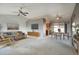 Open living and dining area with a view into the kitchen at 14702 W Buttonwood Dr, Sun City West, AZ 85375