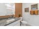 Well lit bathroom with gray granite countertops and tiled shower at 1649 N Fenway Dr, Florence, AZ 85132