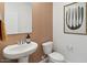 Stylish powder room with pedestal sink and patterned walls at 1649 N Fenway Dr, Florence, AZ 85132