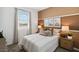 Comfortable bedroom featuring an accent wall, neutral colors, and natural lighting at 1649 N Fenway Dr, Florence, AZ 85132