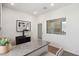 Home office featuring natural light, a desk with a granite countertop, and modern decor at 1649 N Fenway Dr, Florence, AZ 85132