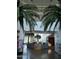 Spacious lobby with high ceilings, tropical plants, and a reception desk at 1649 N Fenway Dr, Florence, AZ 85132