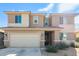 Two-story house with a neutral color scheme and a two-car garage at 18443 W Villa Chula Ln, Surprise, AZ 85387