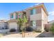 Two-story house with neutral siding and landscaping, showcasing curb appeal at 18443 W Villa Chula Ln, Surprise, AZ 85387