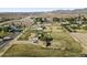 Aerial view of a house and large lot, with distant mountains visible at 19320 W Melvin St, Buckeye, AZ 85326