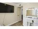 Stylish bedroom with vanity and large TV at 19320 W Melvin St, Buckeye, AZ 85326