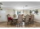 Formal dining room features hardwood floors, ornate chairs, and a large dining table at 19320 W Melvin St, Buckeye, AZ 85326