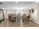 Elegant dining room with hardwood floors and a large formal dining table at 19320 W Melvin St, Buckeye, AZ 85326