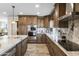 Spacious kitchen with granite island, stainless steel appliances, and rich wood cabinetry at 19320 W Melvin St, Buckeye, AZ 85326