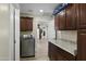 Bright laundry room with cabinets and counter space at 19320 W Melvin St, Buckeye, AZ 85326