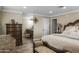 Serene main bedroom with plush bedding, ensuite bathroom, and ample closet space at 19320 W Melvin St, Buckeye, AZ 85326