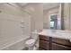 Clean bathroom with tub, toilet and vanity at 19929 W Roma Ave, Litchfield Park, AZ 85340