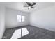 Bright bedroom with carpet flooring and a window at 205 E Jackson Ave, Buckeye, AZ 85326