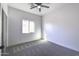 Spacious bedroom with carpet and window at 205 E Jackson Ave, Buckeye, AZ 85326