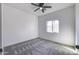 Bright bedroom featuring neutral walls and carpet flooring at 205 E Jackson Ave, Buckeye, AZ 85326