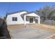 Rear view of house showcasing covered patio and concrete slab at 205 E Jackson Ave, Buckeye, AZ 85326