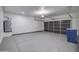 Attached garage with dark gray door and epoxy floor at 205 E Jackson Ave, Buckeye, AZ 85326