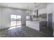 Modern kitchen with gray cabinets, quartz countertops, and island at 205 E Jackson Ave, Buckeye, AZ 85326