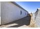 Side yard view with block wall and access gate at 205 E Jackson Ave, Buckeye, AZ 85326