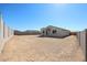 A view of the home's backyard featuring the outdoor living space, and block wall at 24636 W Hopi St, Buckeye, AZ 85326