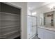 This modern bathroom offers ample storage with a shower and closet at 24636 W Hopi St, Buckeye, AZ 85326