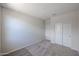 Empty carpeted bedroom with closet and white walls at 24636 W Hopi St, Buckeye, AZ 85326