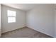 Carpeted bedroom with a window and bright walls at 24636 W Hopi St, Buckeye, AZ 85326