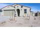 Inviting single-story home with a neutral color scheme, two-car garage, and front yard landscaping at 24636 W Hopi St, Buckeye, AZ 85326