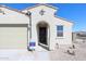 Single-story home features a well-kept front yard and neutral color scheme at 24636 W Hopi St, Buckeye, AZ 85326