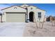 Inviting single-story home featuring a two-car garage, neutral color scheme, and landscaping at 24636 W Hopi St, Buckeye, AZ 85326