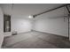 Inside the garage, a water heater stands next to the door, highlighting the utility features of the home at 24636 W Hopi St, Buckeye, AZ 85326