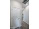 Bright hallway with tile flooring leading to various rooms, showcasing the home's layout at 24636 W Hopi St, Buckeye, AZ 85326