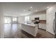 Open concept kitchen with granite counters and tile flooring at 24636 W Hopi St, Buckeye, AZ 85326