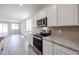 Bright kitchen with white cabinets and stainless steel appliances at 24636 W Hopi St, Buckeye, AZ 85326