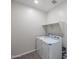 The laundry room features a washer, dryer, and a shelf at 24636 W Hopi St, Buckeye, AZ 85326