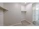 A walk-in closet with an attached bathroom at 24636 W Hopi St, Buckeye, AZ 85326