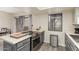 Well-equipped kitchen featuring stainless steel appliances and a kitchen island at 2524 S El Paradiso -- # 106, Mesa, AZ 85202