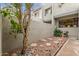 Small patio area with gravel and a tree for a peaceful setting at 2524 S El Paradiso -- # 106, Mesa, AZ 85202