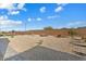 Desert landscape backyard with gravel and some plants at 26330 W Kimberly Way, Buckeye, AZ 85396