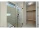 Modern bathroom with a glass enclosed shower and built-in bench at 26330 W Kimberly Way, Buckeye, AZ 85396