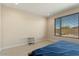 Bedroom with large window and end table at 26330 W Kimberly Way, Buckeye, AZ 85396