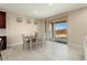 Bright dining area with sliding door access to backyard at 26330 W Kimberly Way, Buckeye, AZ 85396