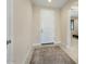 Bright and airy entryway with a neutral color scheme and rug at 26330 W Kimberly Way, Buckeye, AZ 85396