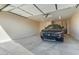 Spacious garage with overhead door and ample space for a vehicle at 26330 W Kimberly Way, Buckeye, AZ 85396