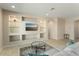 Living room with built-in shelving and a large TV at 26330 W Kimberly Way, Buckeye, AZ 85396