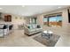 Living area with light colored sofa and view to backyard at 26330 W Kimberly Way, Buckeye, AZ 85396