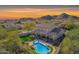 Luxury home with pool and scenic mountain views at sunset at 28225 N 65Th Ln, Phoenix, AZ 85083