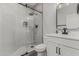 Modern bathroom with white vanity, frameless shower, and black accents at 28225 N 65Th Ln, Phoenix, AZ 85083