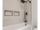 Clean bathroom with a shower/tub combo and modern fixtures at 28225 N 65Th Ln, Phoenix, AZ 85083