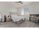 Spacious bedroom with a queen bed, nightstand and a work desk at 28225 N 65Th Ln, Phoenix, AZ 85083